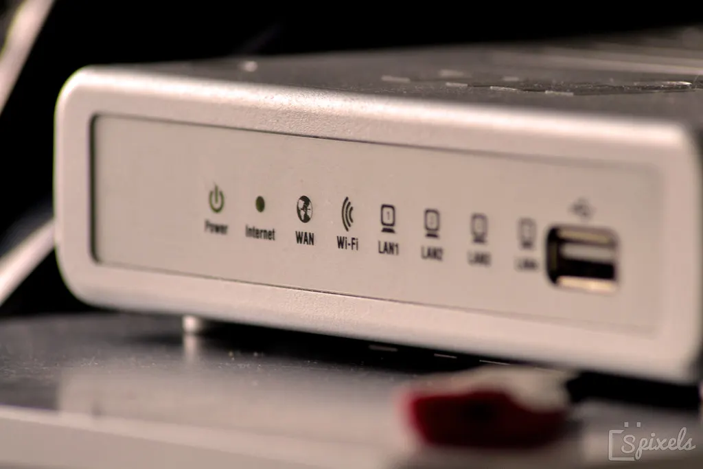 The front of a home internet router, its status lights for power, internet, WAN, and Wi-Fi.